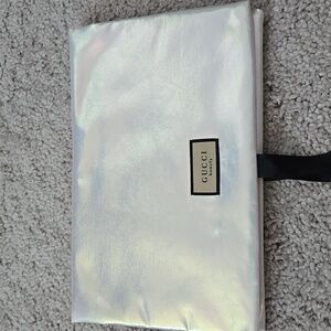 Brand New GUCCI pouch bag metallic silver with beautiful floral print interior